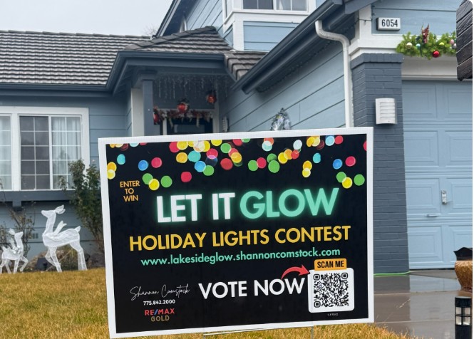 A Let It Glow Holiday Lights Contest yard sign in Lakeside Lewis