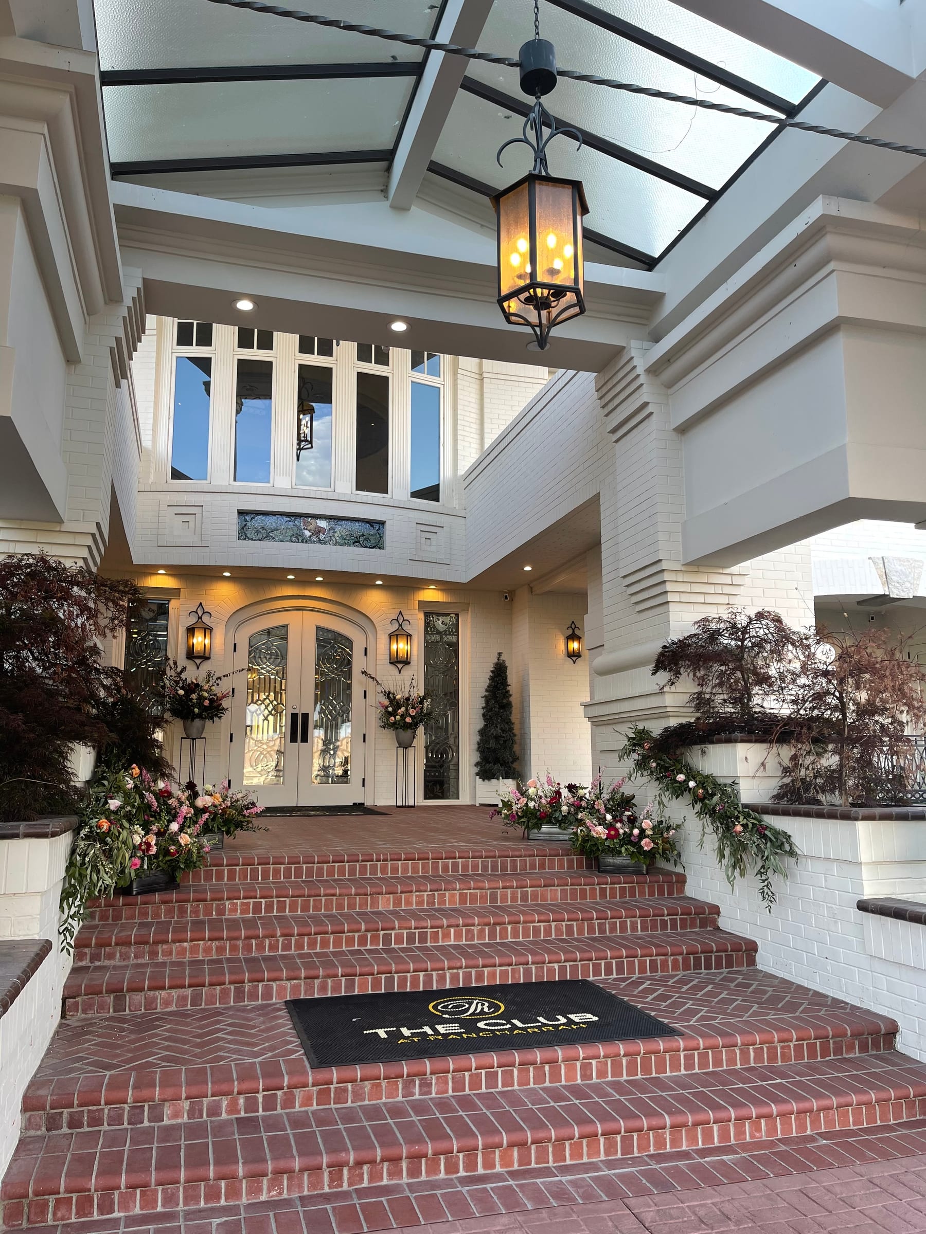 The front entrance of the Rancharrah clubhouse, decorated with flowers