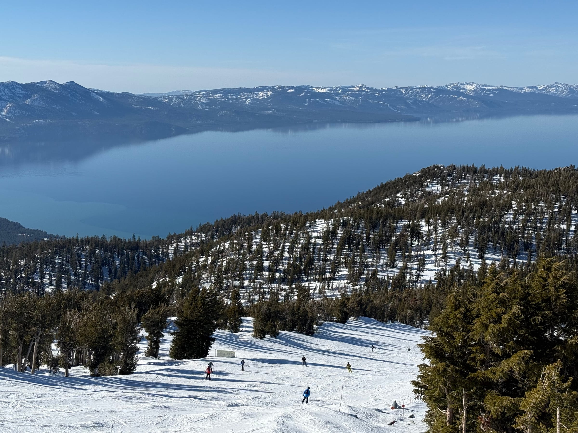 Skiers on the slopes at Heavenly, overlooking Lake Tahoe