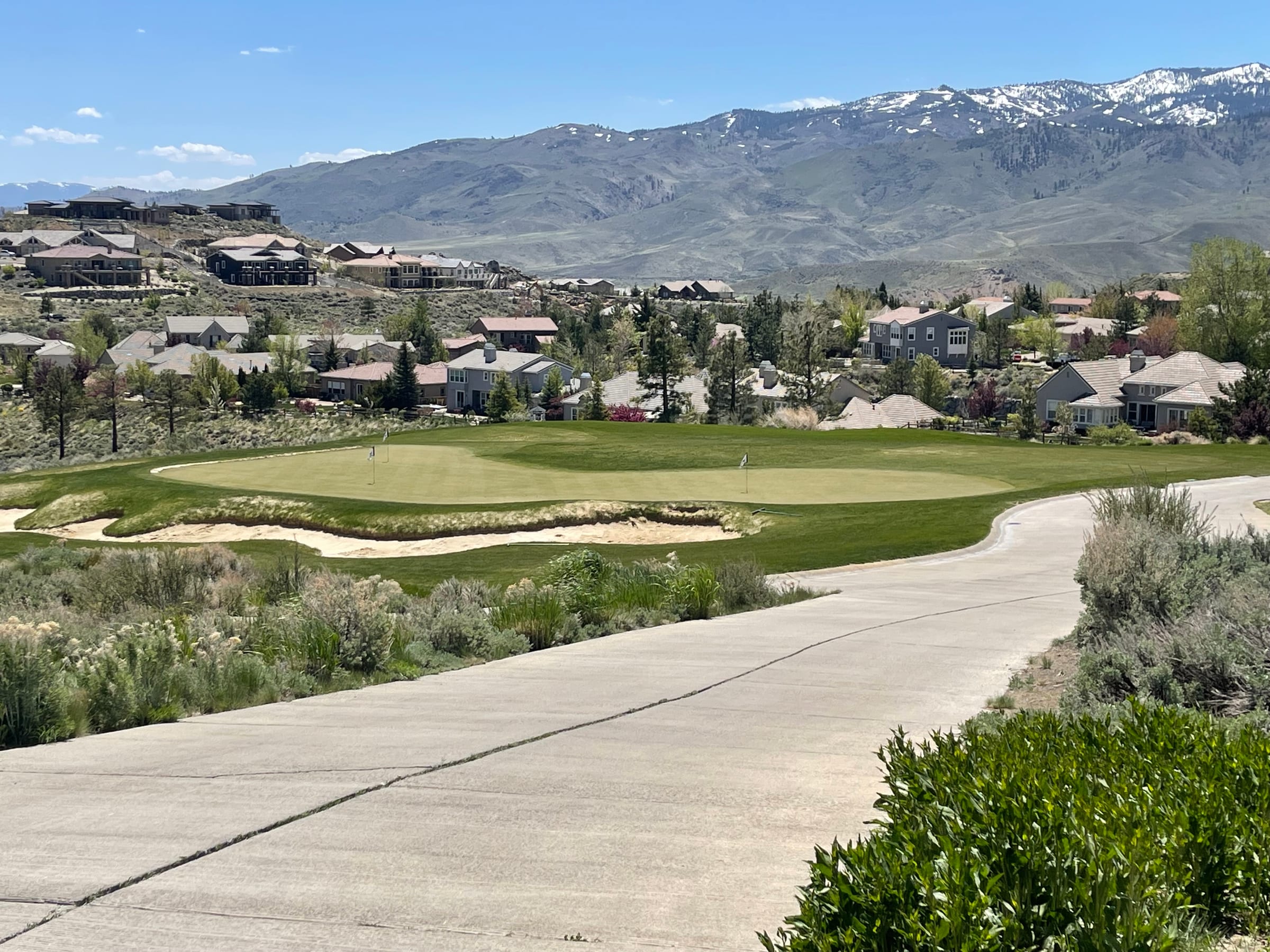A green on the Somersett golf course with mountain views