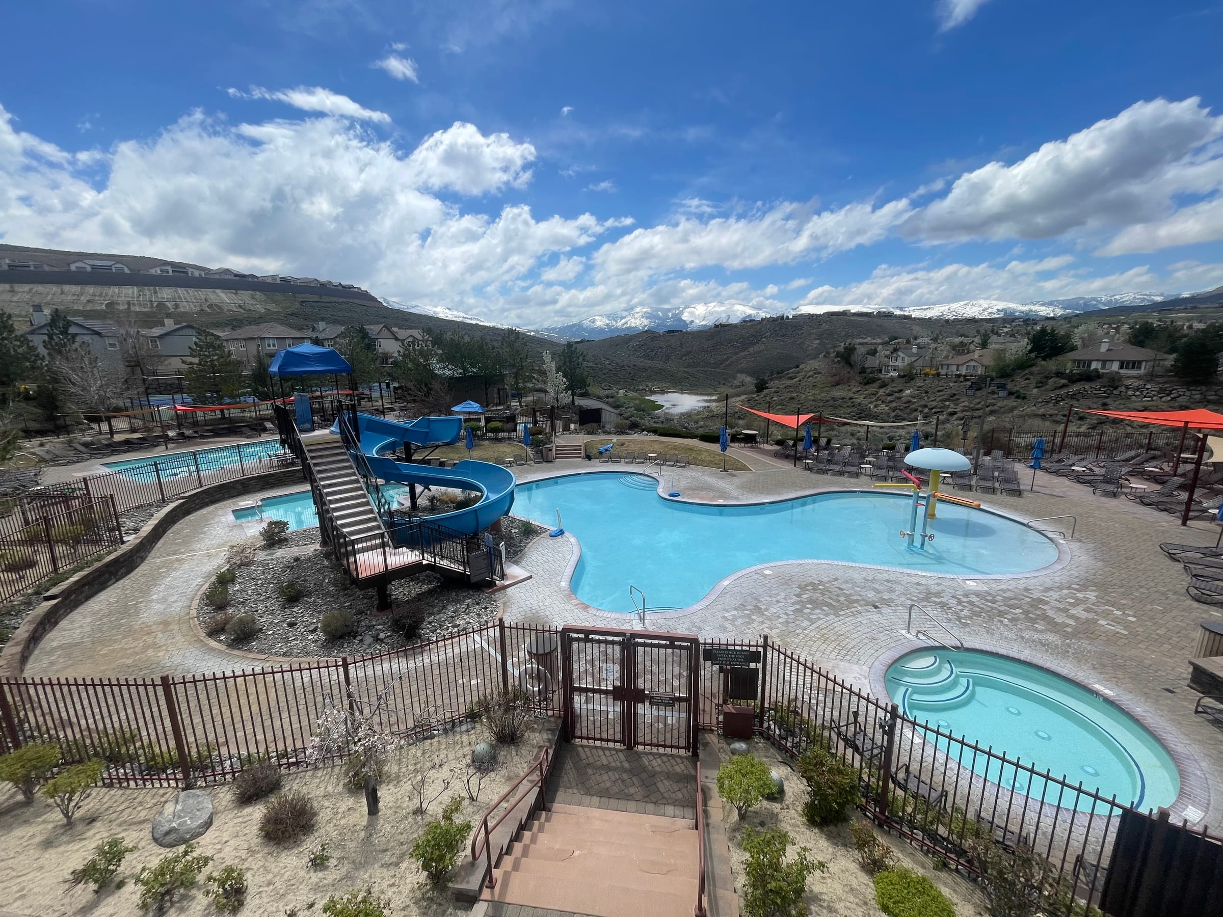 The pool complex at The Club at Somersett, with a water slide and hot tub
